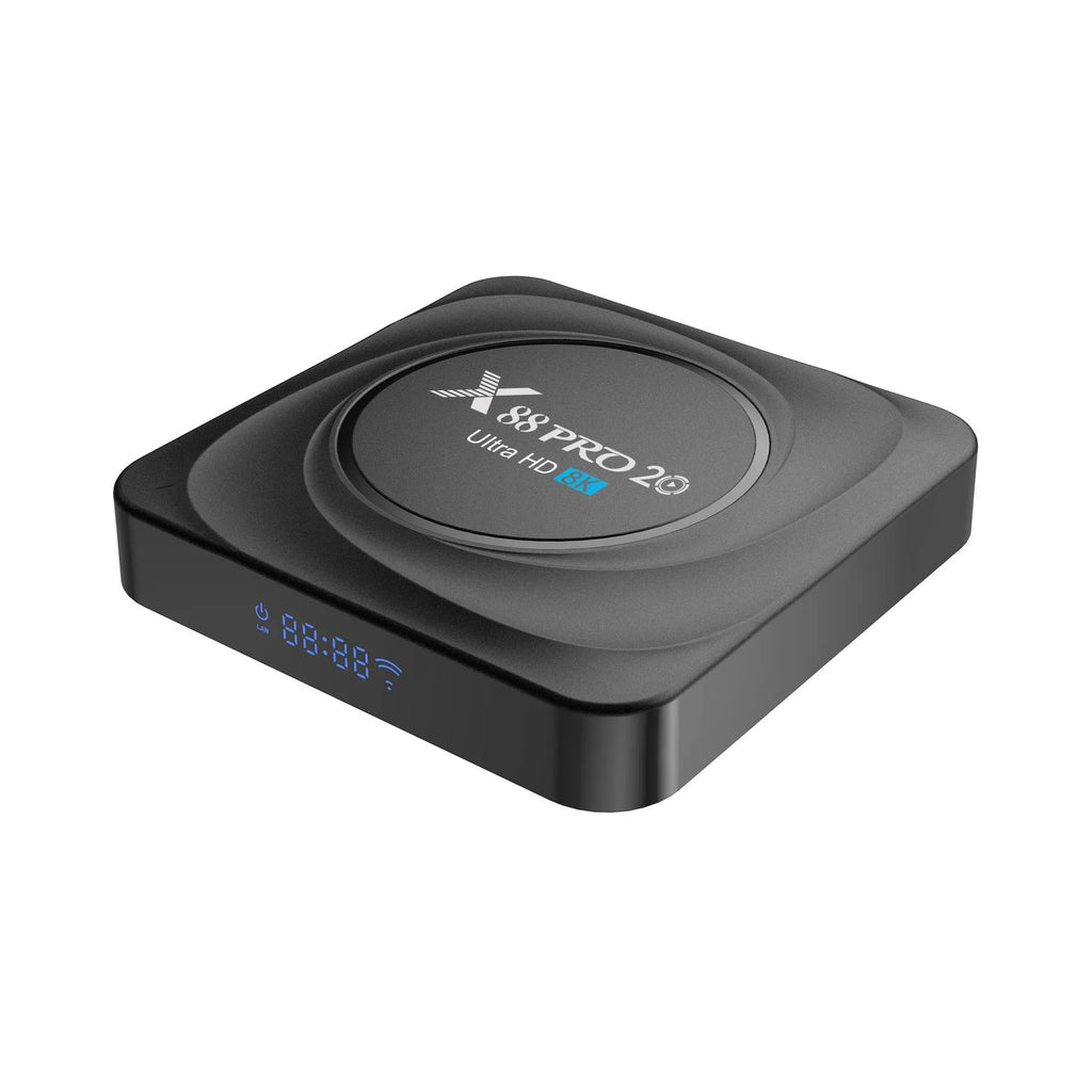 Compact black Android 11 TV box with remote control and HDMI cable on a table