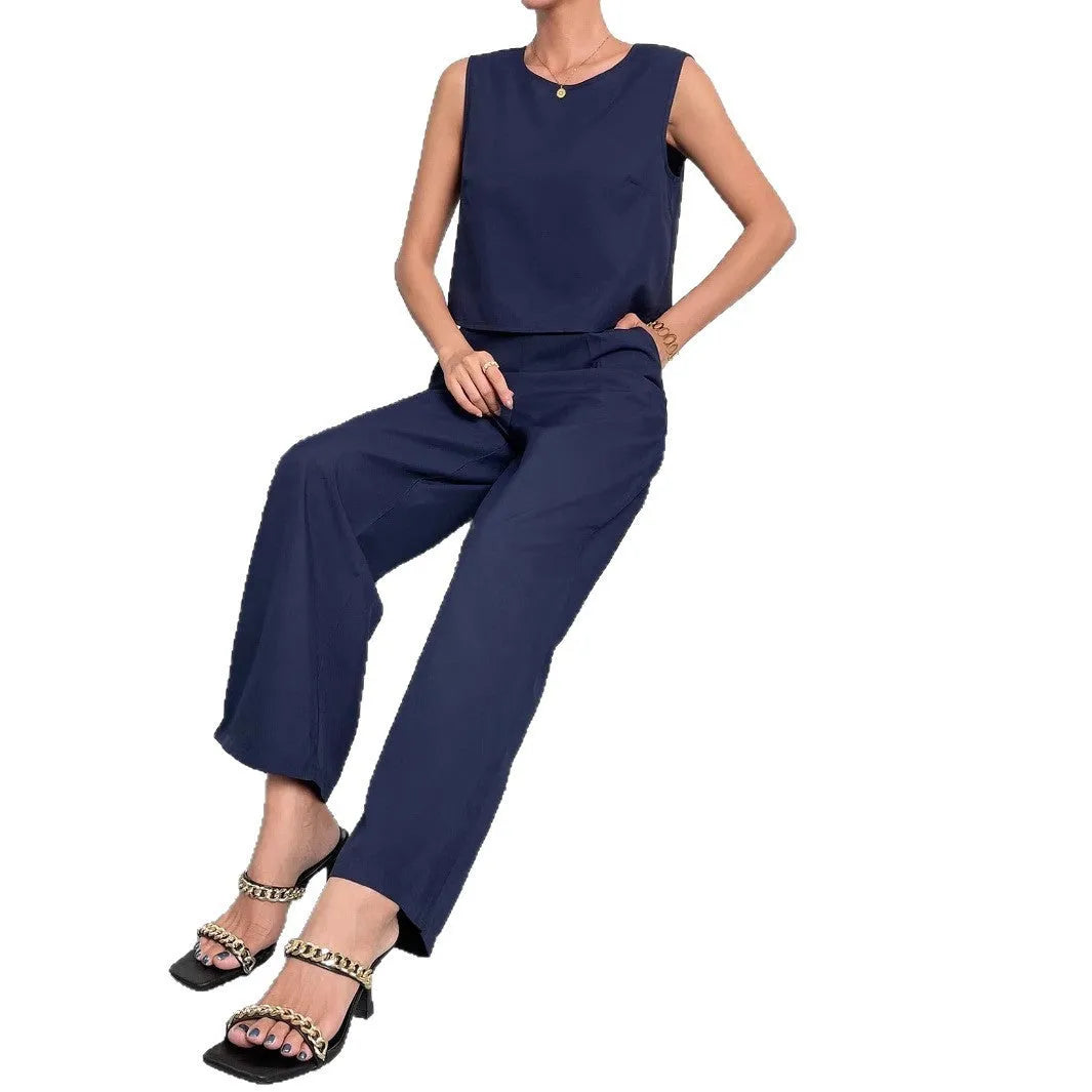 Women's red polyester two-piece set featuring a sleeveless top and wide-leg trousers on a hanger.