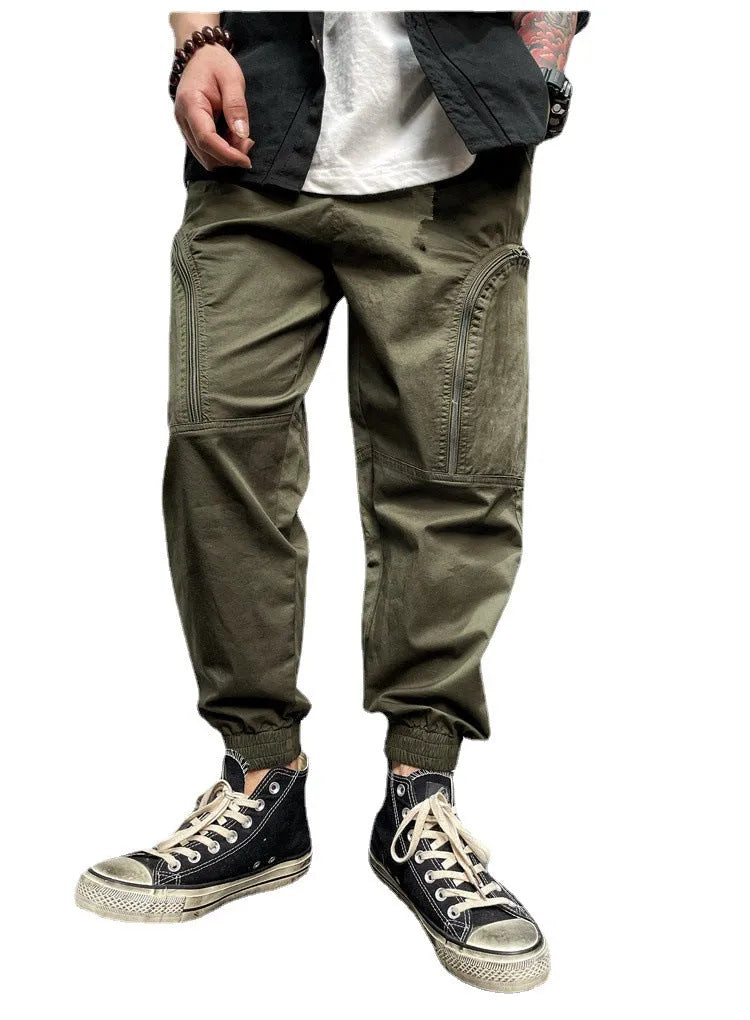 Men's elastic waist cotton cargo trousers with zippered pockets, loose fit, in khaki colour on plain background