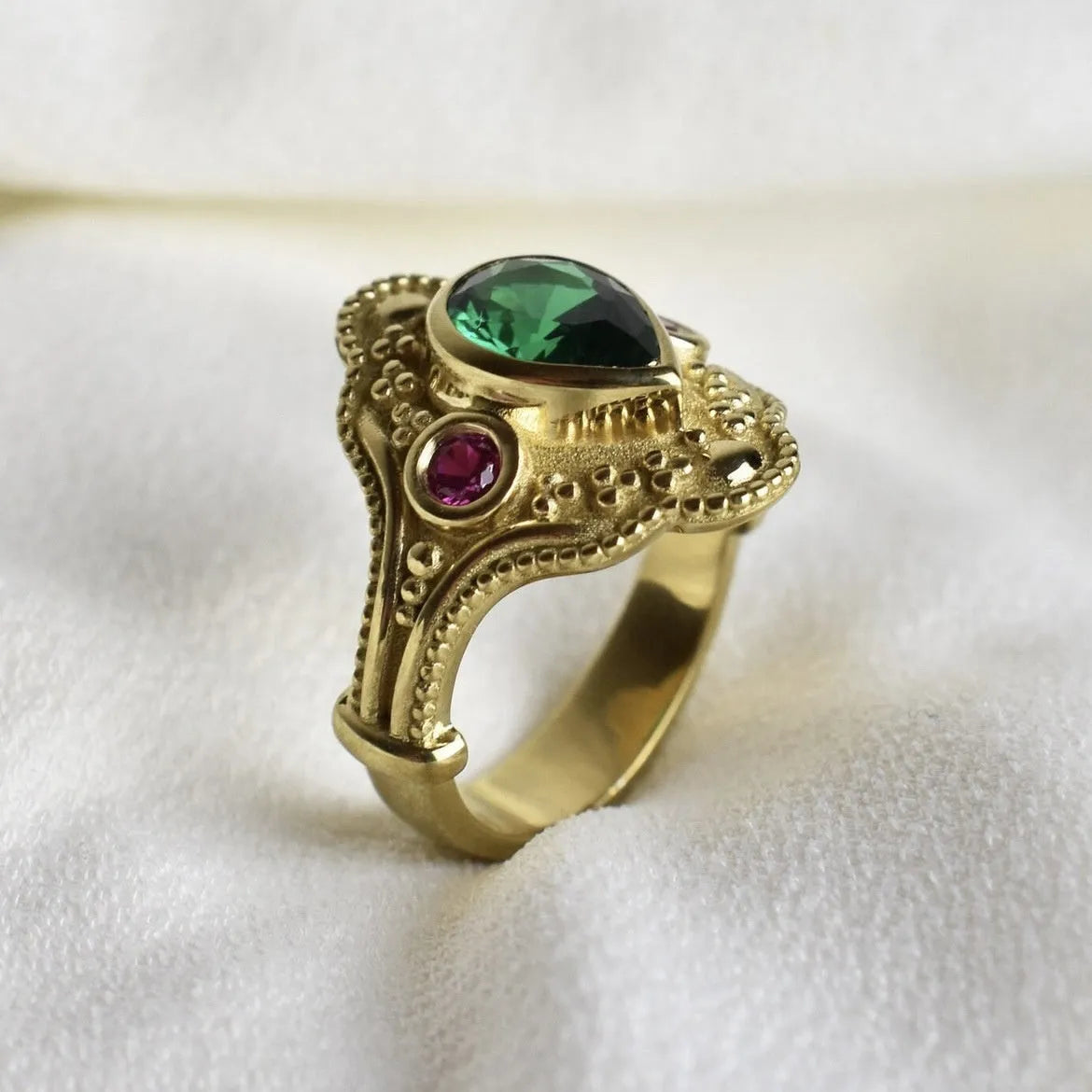 Women's geometric gold-plated ring with electroplated golden lvzuan finish shown from side view