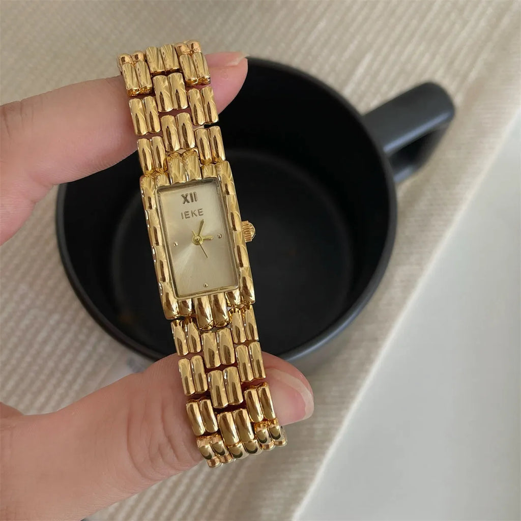 Women's mid-century inspired bracelet watch with 15mm dial and butterfly clasp in silver and gold colour options