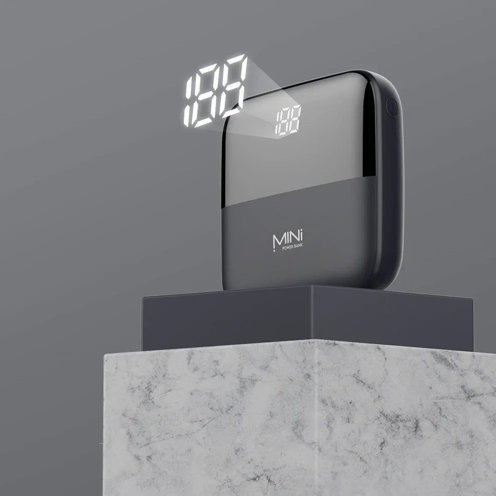 Black Android 10000mAh portable power bank with digital display showing battery percentage and dual USB ports.