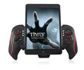 PG-9023 wireless telescopic gamepad controller holding a mobile phone