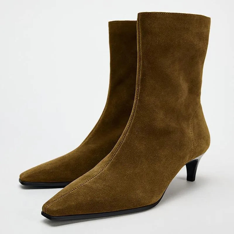 Brown square toe ankle boots with a side zipper and a mid-height kitten heel on a waterproof platform.