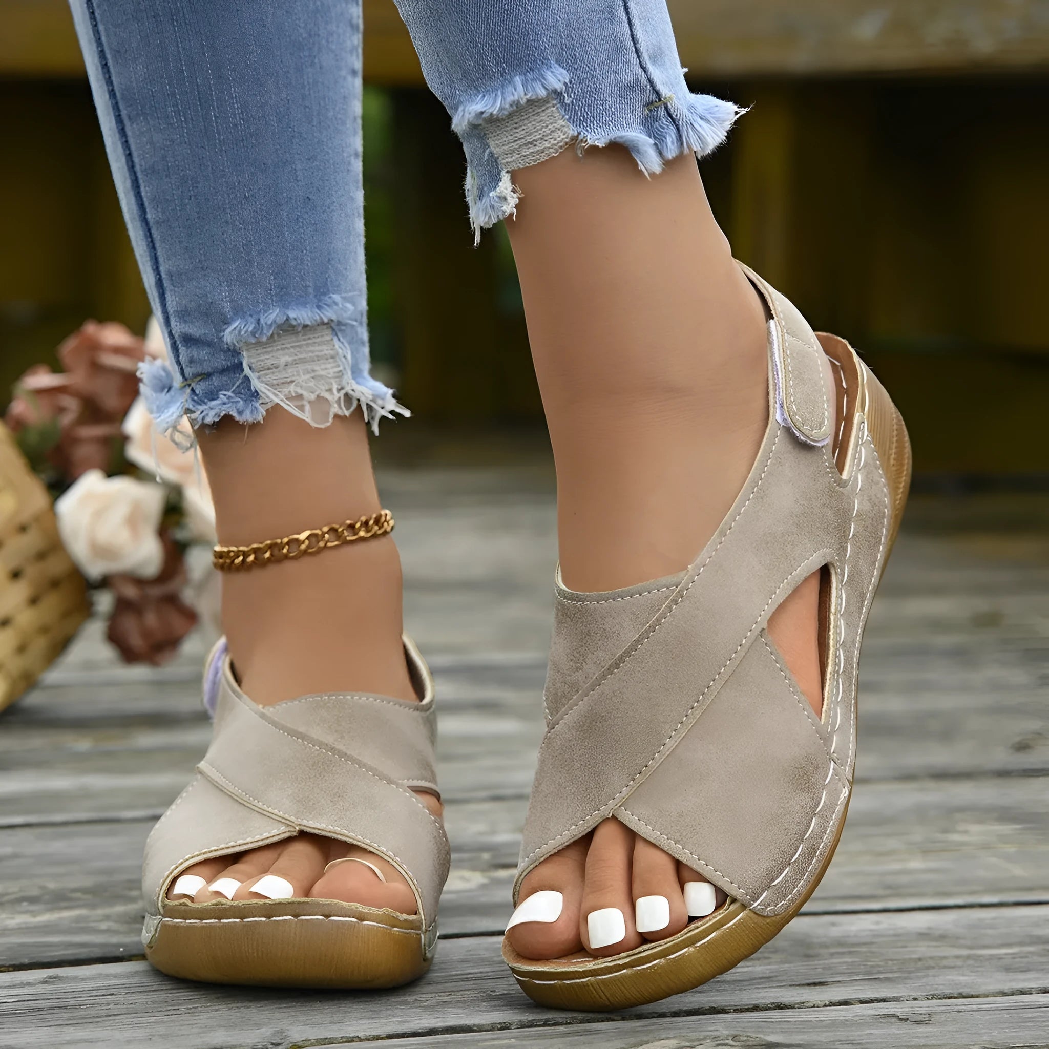 Brown Roman platform sandals with open toe and Velcro strap on a white background.