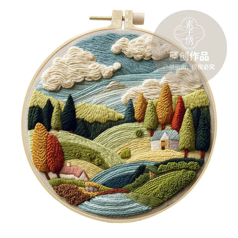 Embroidery DIY kit with landscape printed fabric, bamboo frame, thread, and needles for handmade cloth art