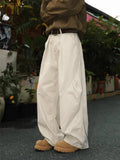 Men's straight leg trousers with pleated front in striped black, brown or apricot colours
