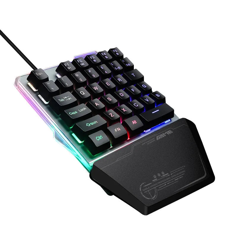 Black G40 Flow Colour one-handed mechanical keyboard with RGB backlit keys on a desk.