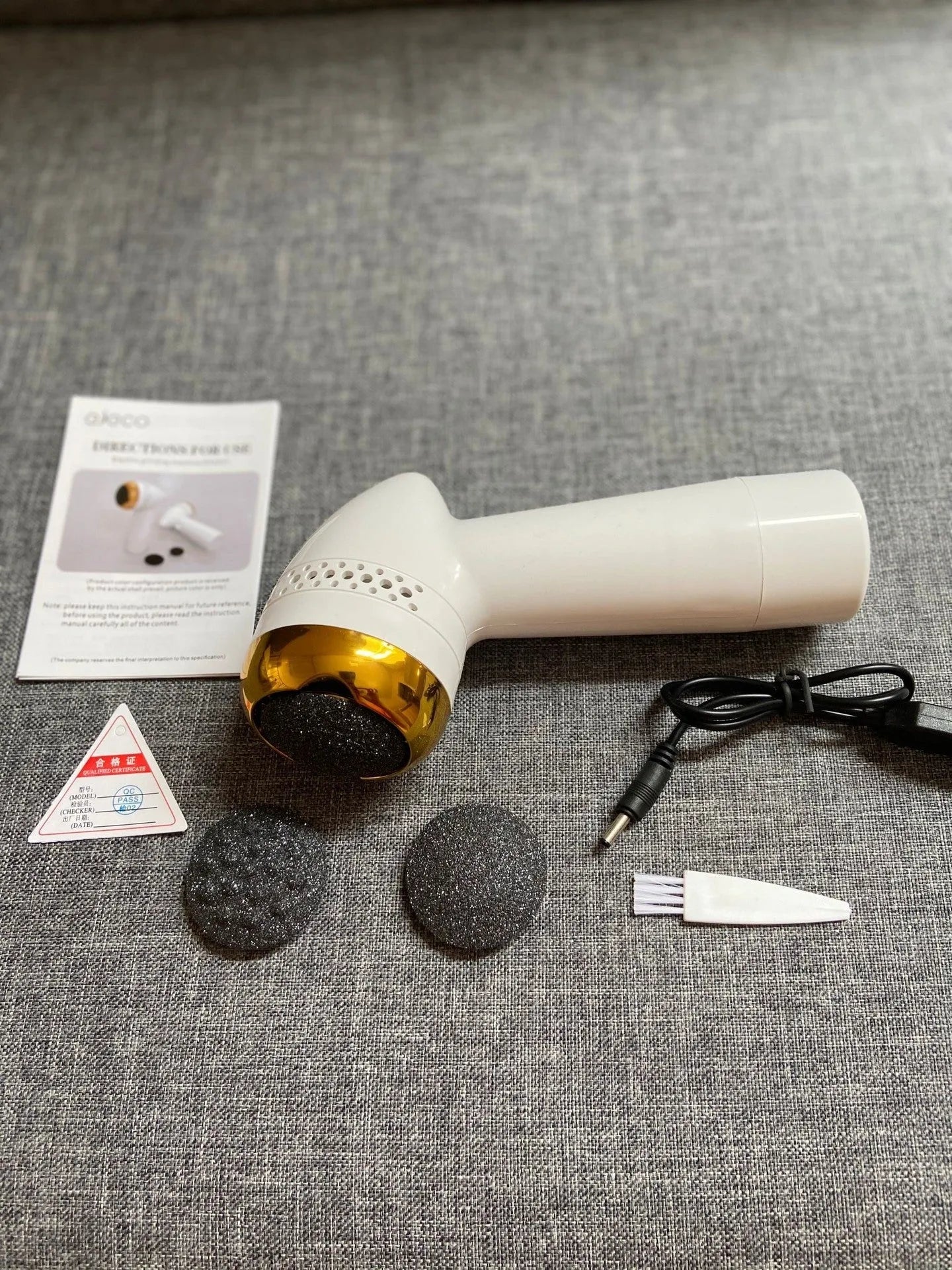 Electric vacuum foot grinder with a refined quartz grinding head in a metallic colour option.