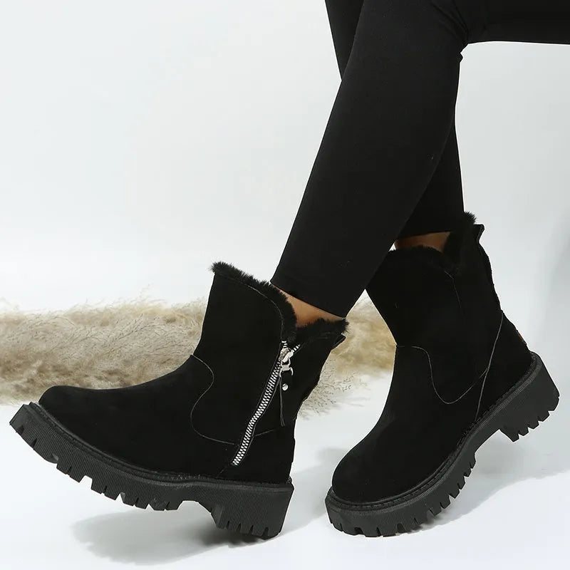 Women's black faux suede high-top snow boots with a side zipper and thick plush lining.