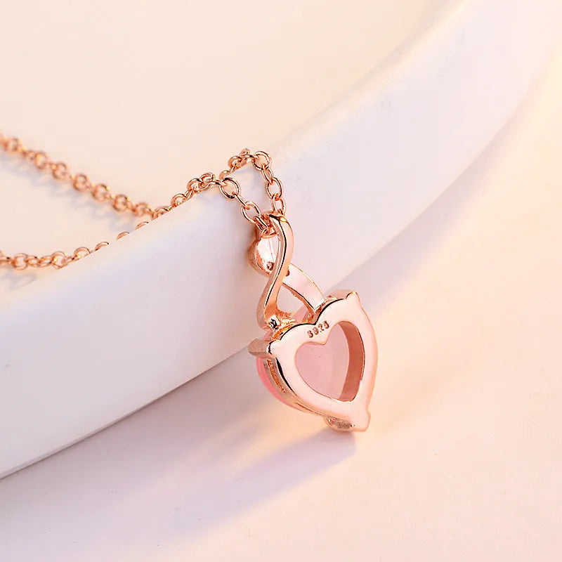 Rose gold heart necklace with pink artificial crystal pendant on cross chain
