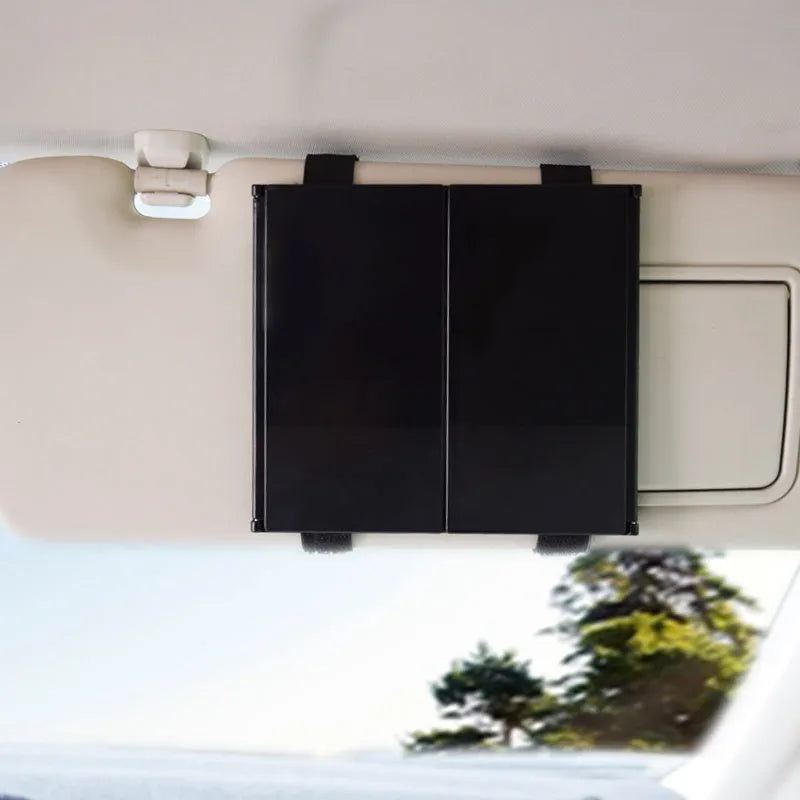 Silver car folding makeup mirror shown open and closed, demonstrating its size change.