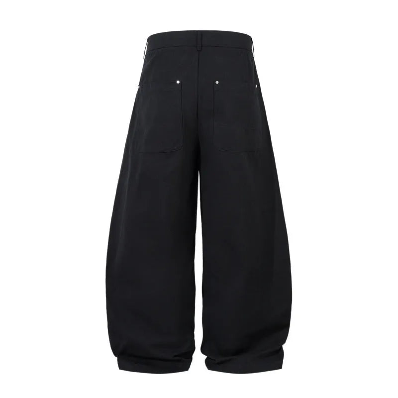 Men's black pleated machete casual pants with loose-fitting wide-leg styling in cotton fabric