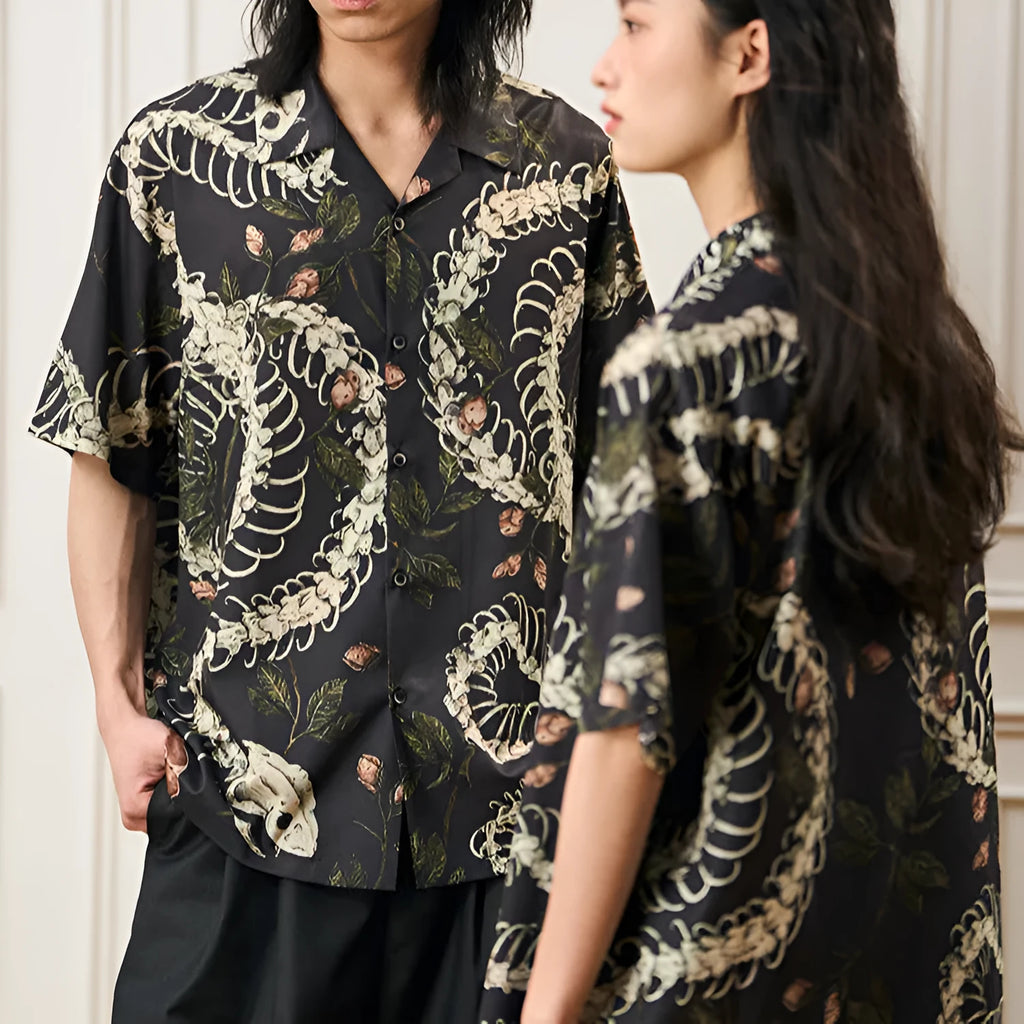 Men's short sleeve Cuban collar shirt featuring a snake bone and floral printed pattern in a loose fit.
