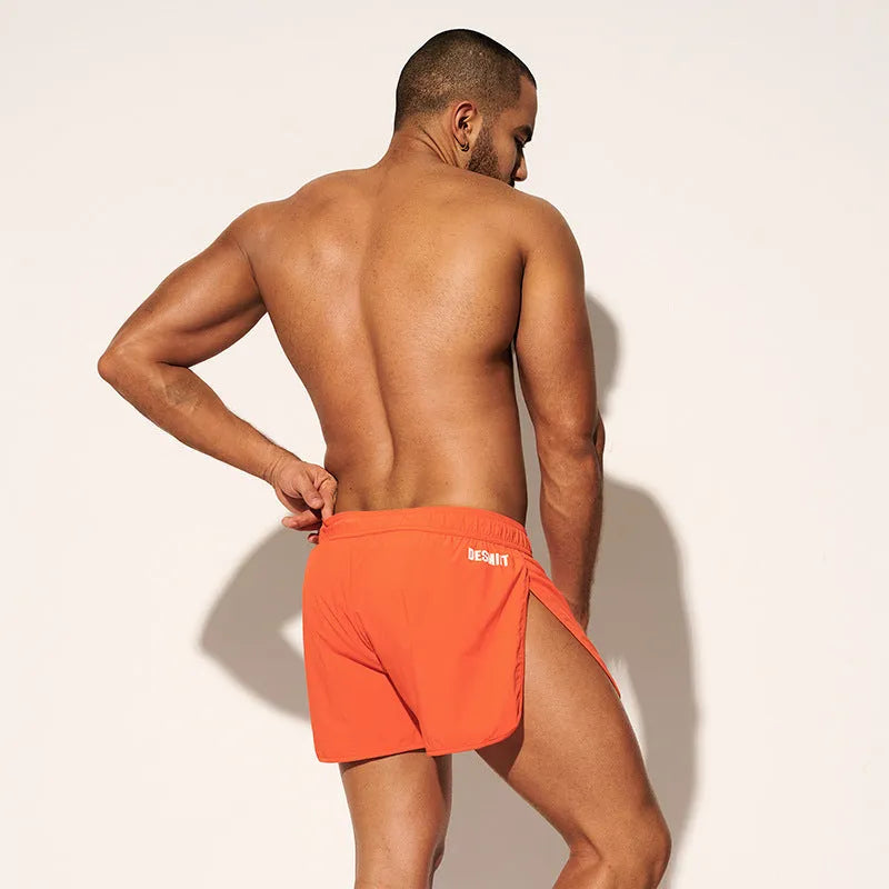 Men's elastic beach shorts in orange, green, and black colours for surfing and summer wear