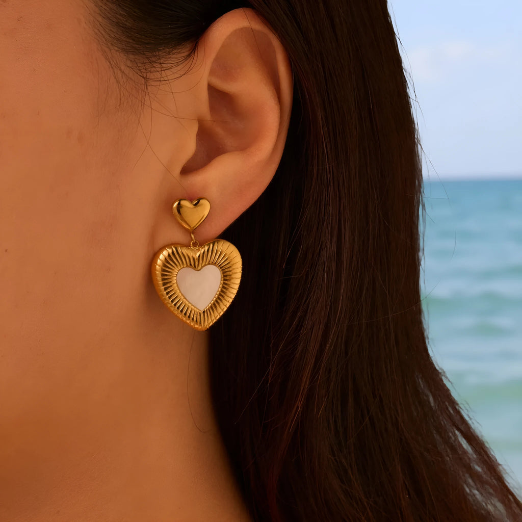 Heart shaped stainless steel earrings with white fritillary pattern and 18K gold electroplated finish