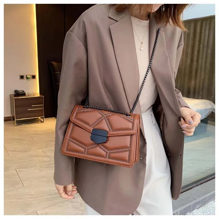 Small square PU shoulder bag with gold rivet studs, chain handle and zipper closure, available in four colours