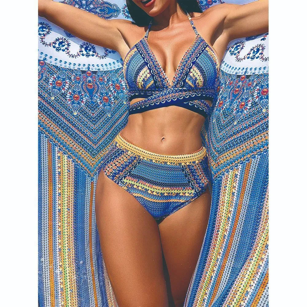 Women's blue high waist bandage bikini set with smock, bra, and briefs on a neutral background.