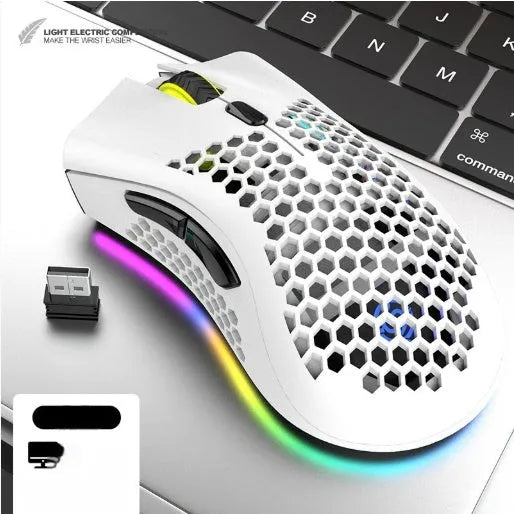 Hollow-out wireless gaming mouse with glowing light, shown in cyan colour on a desk.