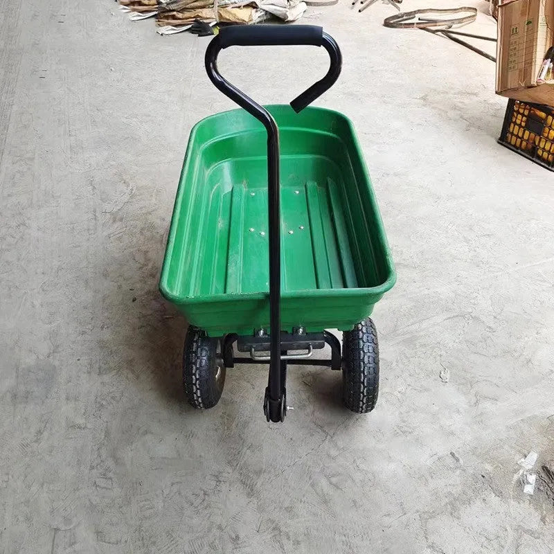 Green four-wheel plastic TC2145 dumptruck toy for kids on a white background.