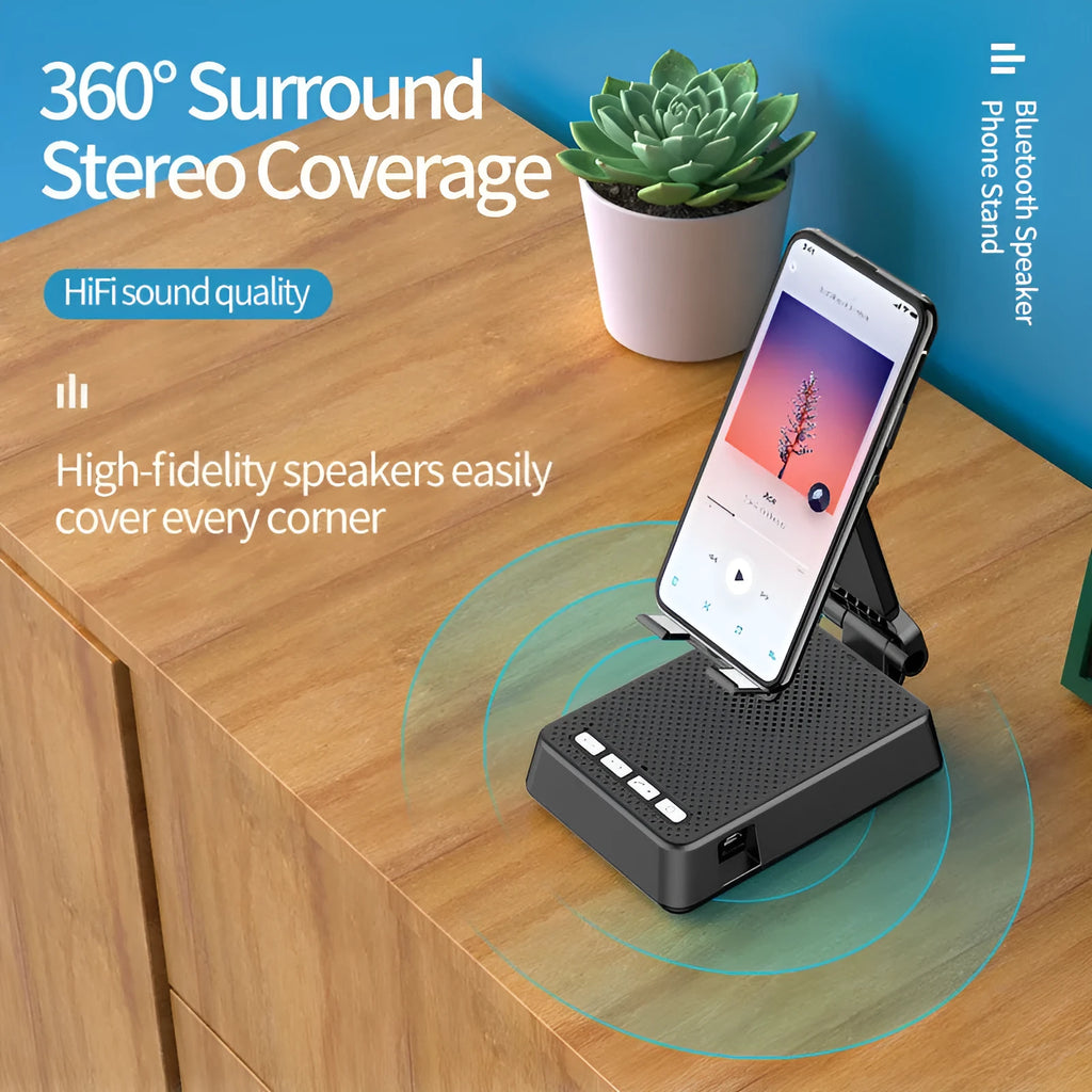 Black mobile phone broadcasting stand with integrated Bluetooth speaker on a desk.