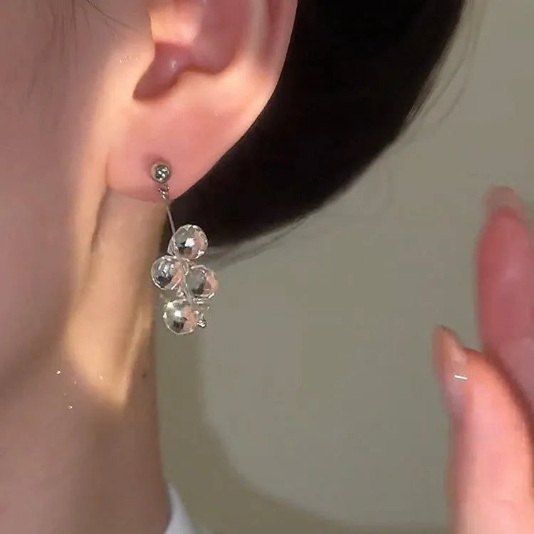 Silver needle simple crystal tassel earrings with geometric round shape in silver finish