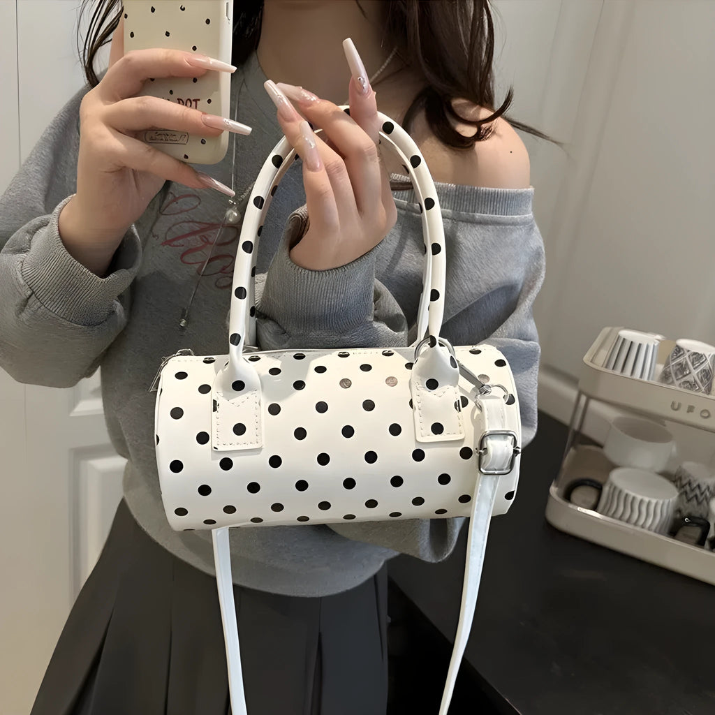 Korean-style cylindrical tote pillow bag in PU leather with stitched seams, black colour, single strap