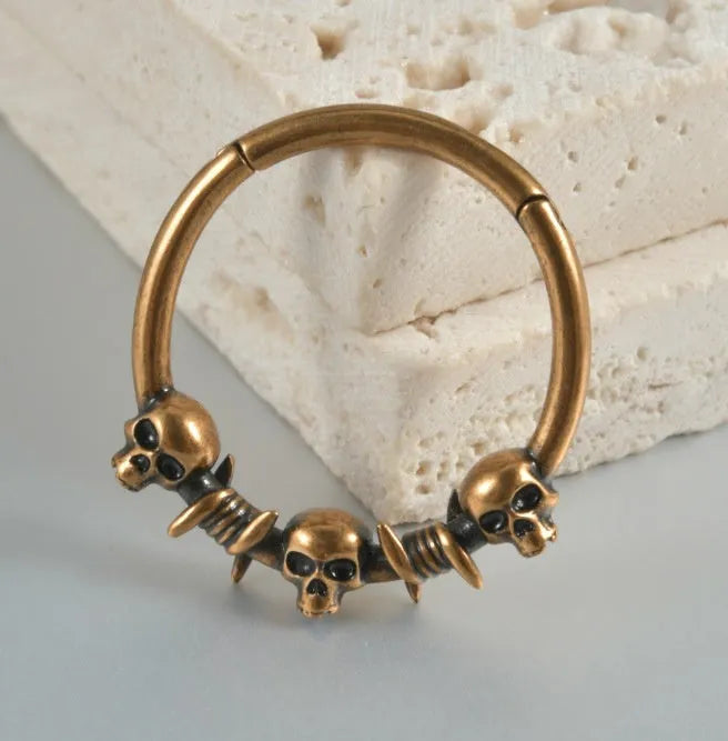 Copper punk earrings with ghost head design in antique silver and gold finishes