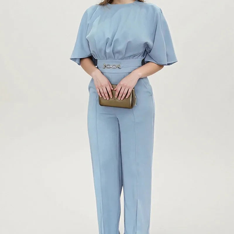 Blue polyester men's suit set with trousers and a long-sleeved top on a hanger