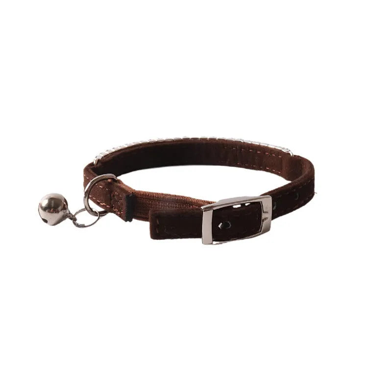 Flocked material cat collar with elastic buckle in assorted colours on a white background.