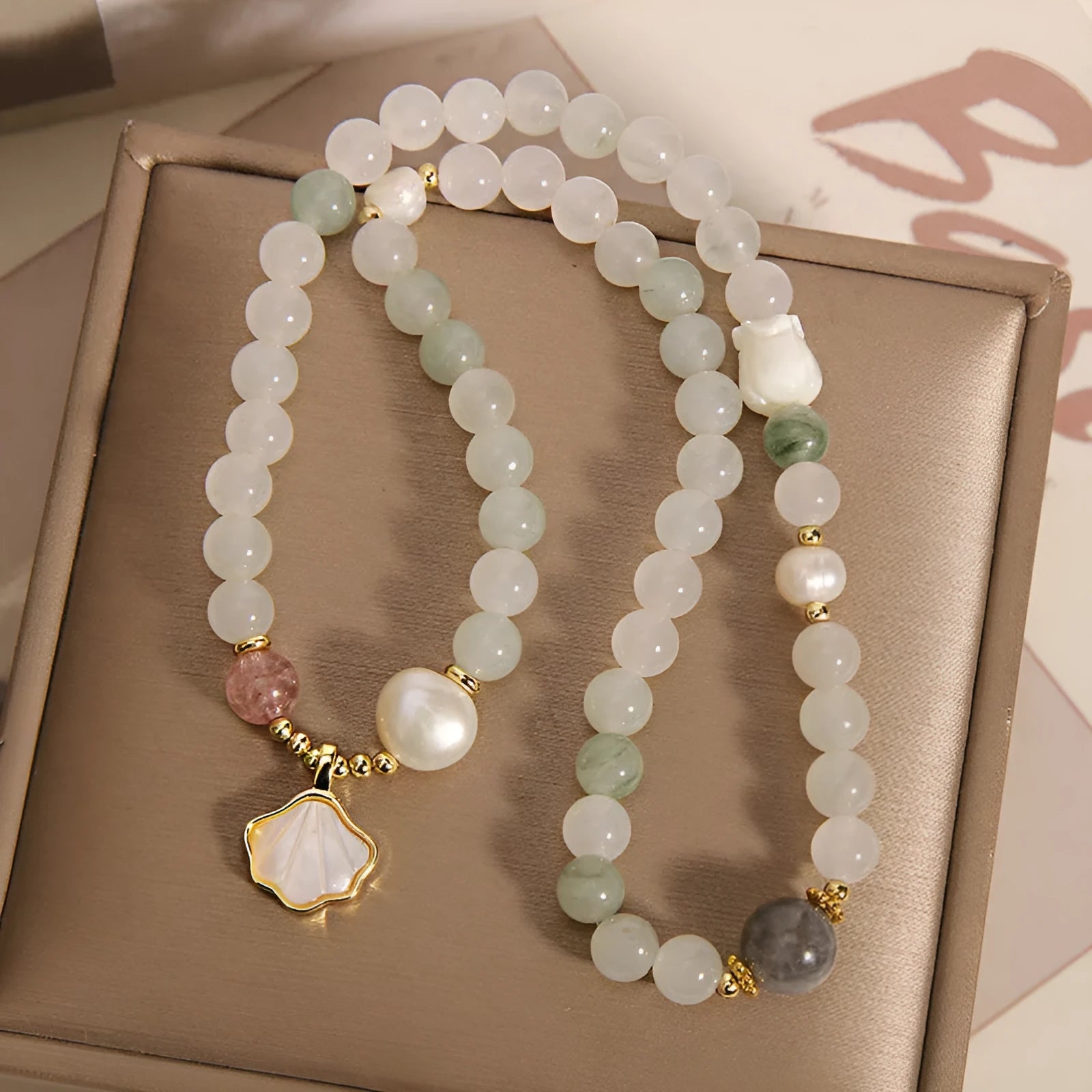 Crystal bracelet with gold-plated artificial gemstone inlay and Tianshan Jade shell ginkgo leaf pendant