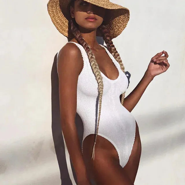 A solid-colour backless one-piece swimsuit for women made from Seersucker fabric, shown in a choice of colours.