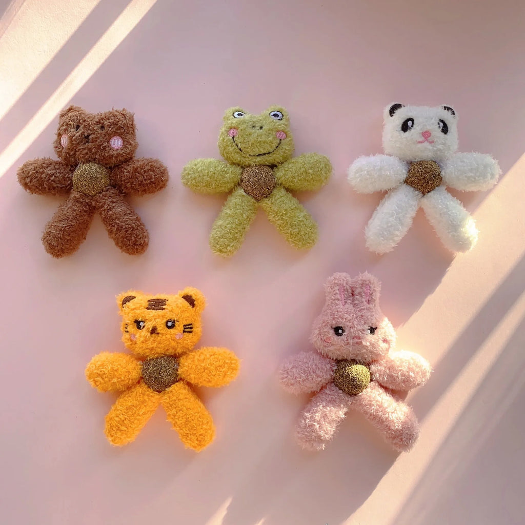 Soft brown bear-shaped catnip chewing ball toy for cats on a white background.