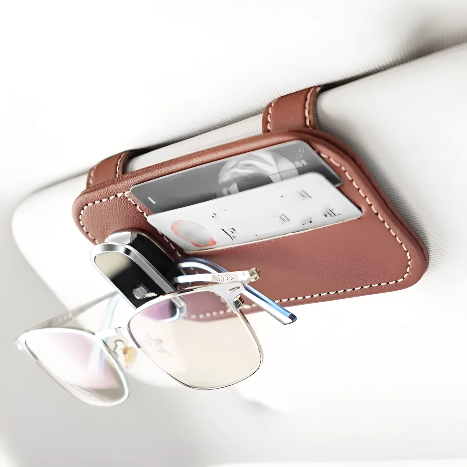Leather car sun visor organiser with clip for sunglasses and card slot in beige colour.