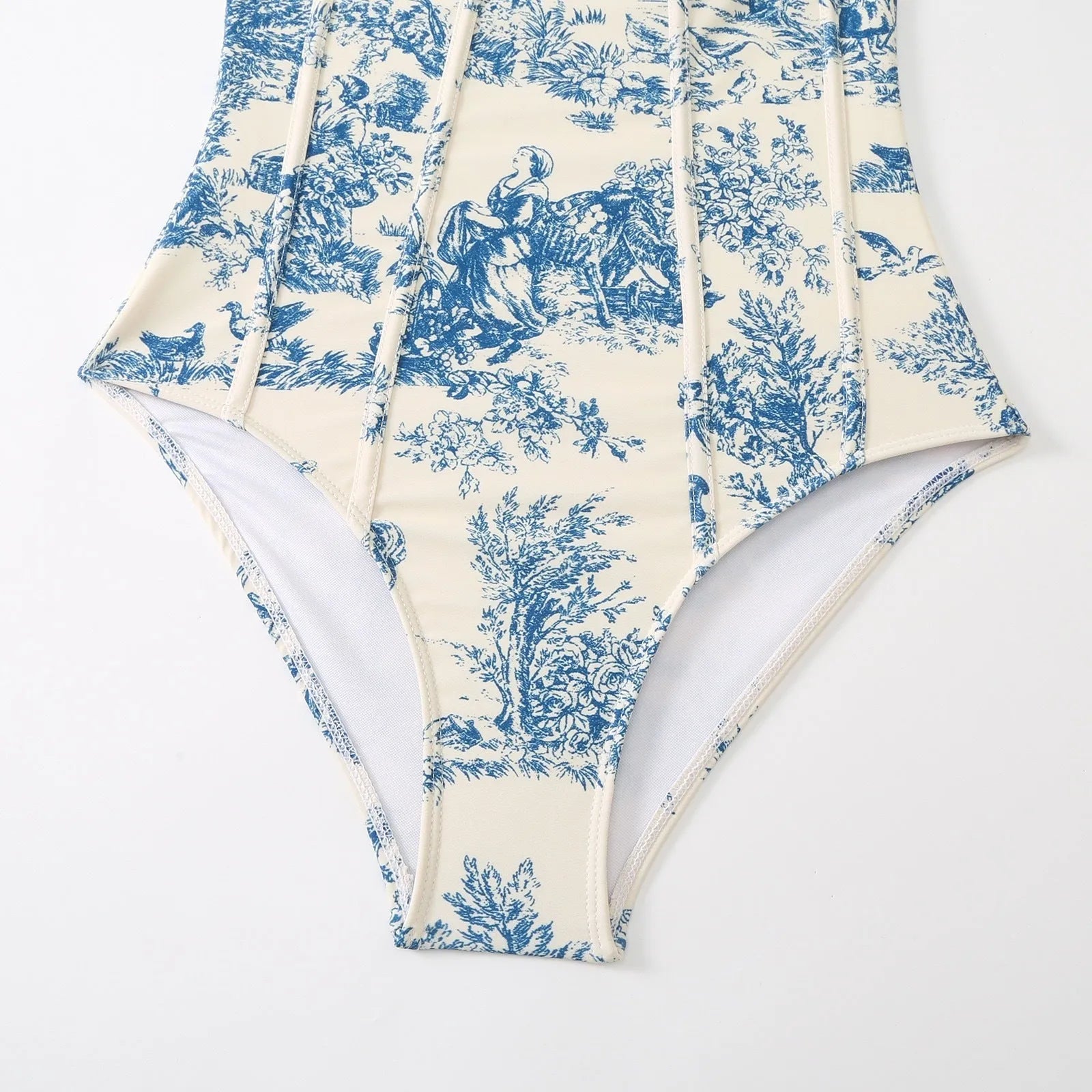 Blue women's one-piece swimsuit with matching gauze skirt on white background