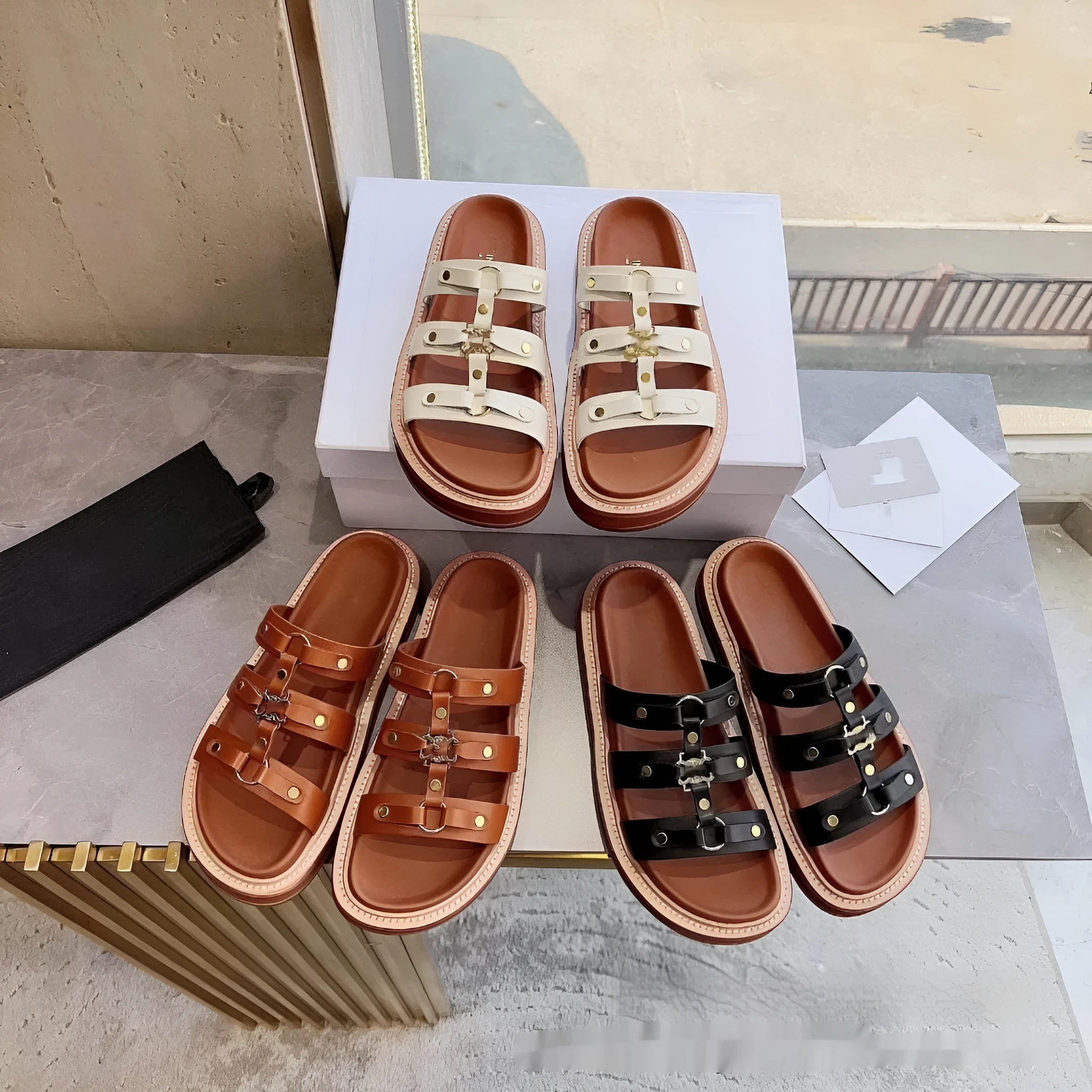 Women's retro Roman sandal slippers in black patent leather with sheepskin upper, shown from the side.