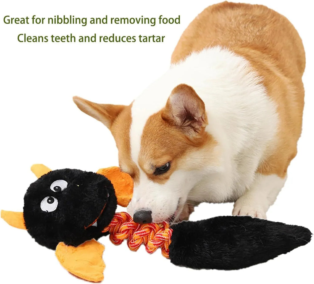 Large green plush dog toy with rope knot and cartoon design on a white background.
