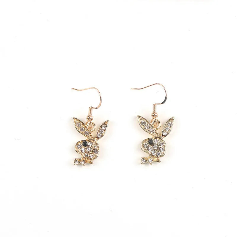 Rabbit stud earrings in silver pink gold colours with cartoon animal design and constellation details