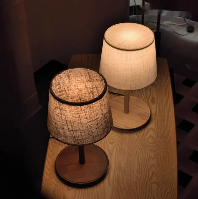 Walnut-colour solid wood bedside lamp with white cloth shade and cable switch