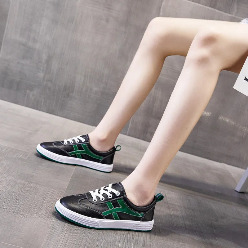 Women's leather Korean style sneakers with elastic band and round toe in black and white options