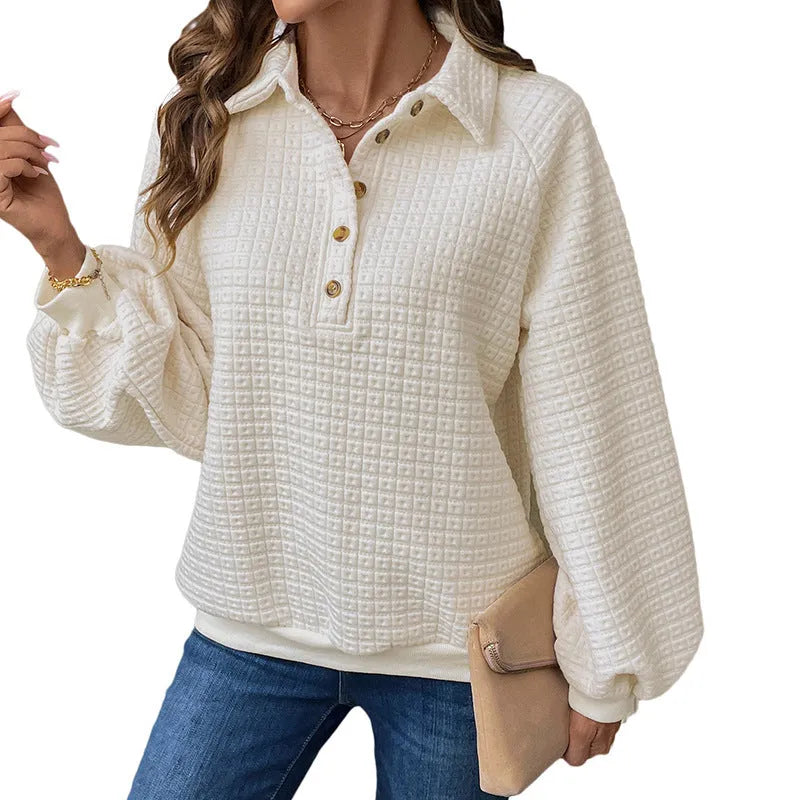 Women's beige textured polo collar long sleeve polyester sweater on a hanger.