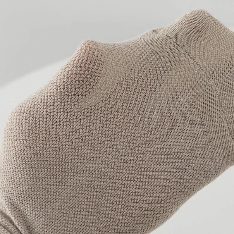 A pair of solid colour low-cut polyester boat socks laid flat.