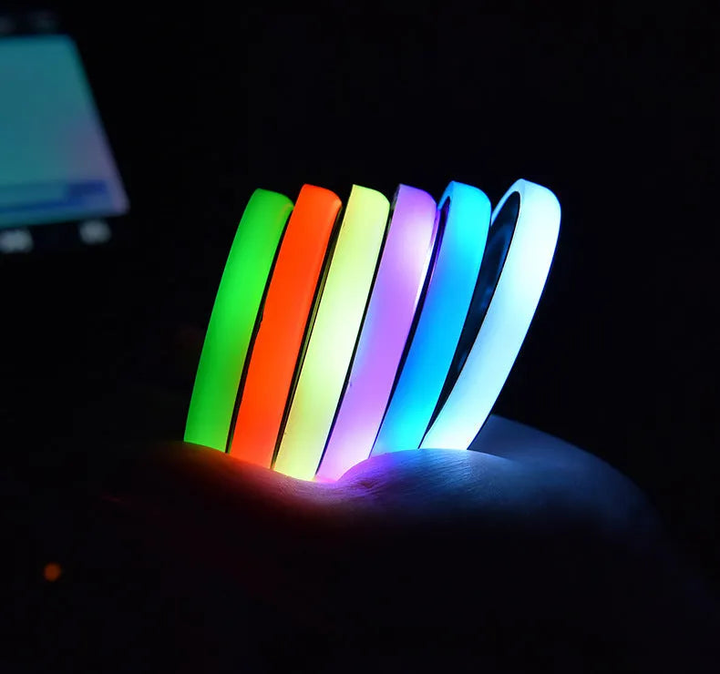 Car cup holder LED light-up coaster showing 7 colour options with USB charging cable