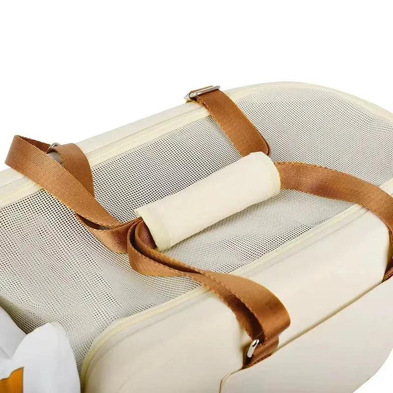 Beige hard-sided pet carrier with one-shoulder strap measuring 43x25x22.5cm for pets under 15kg