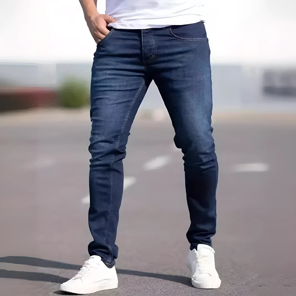 Men's dark blue slim fit jeans with skinny leg design and street fashion style