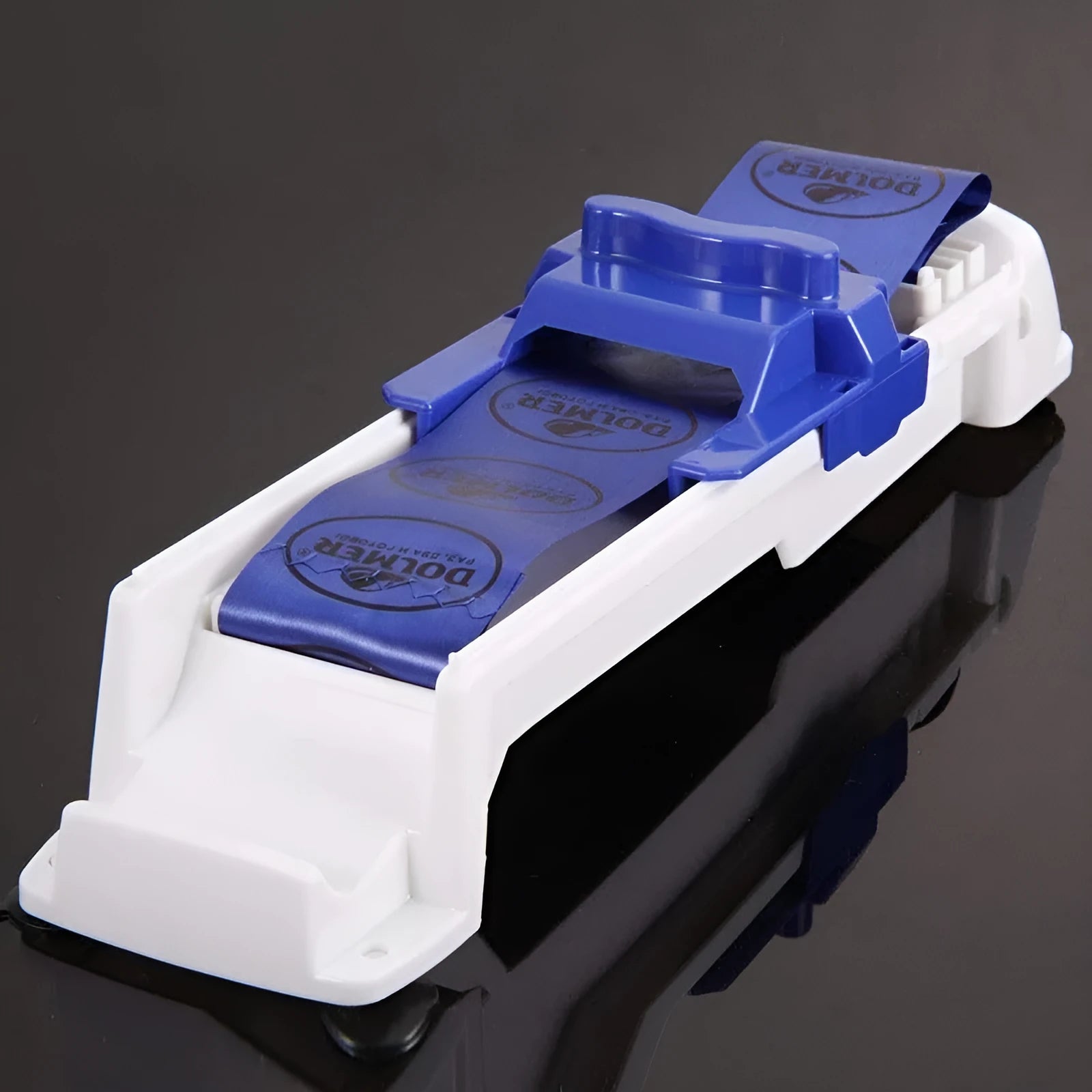 Blue plastic vegetable meat roller from Home Sushi Machine, 36cm by 10cm by 8cm, on a kitchen counter with English packaging