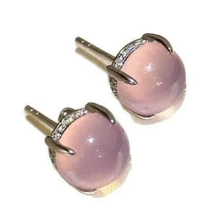 Round egg surface chalcedony stud earrings with four-claw copper settings in green, white, or pink.