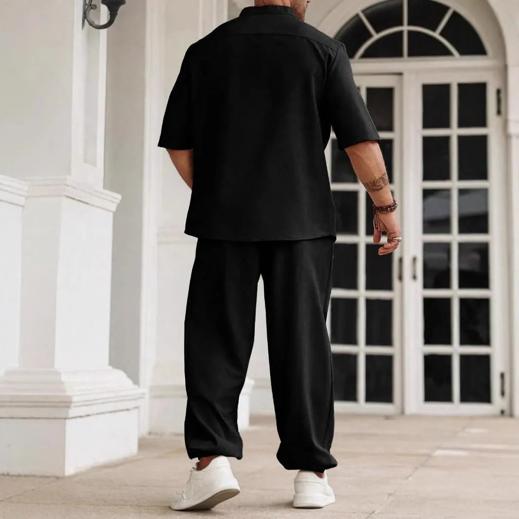 Men's apricot coloured cotton linen short-sleeved shirt jacket and trouser casual set laid flat.