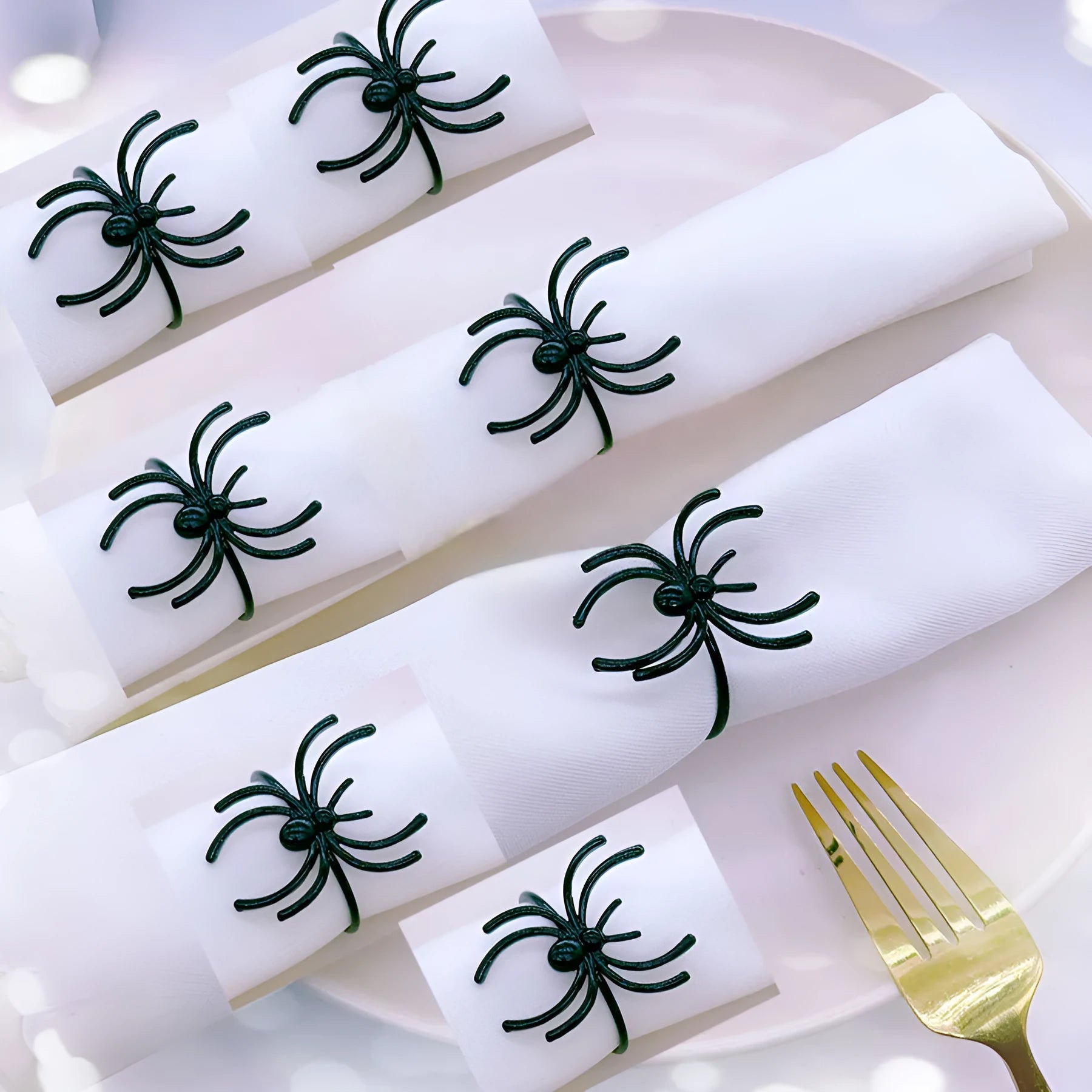 Six black spider-themed alloy napkin rings for Halloween table decorations
