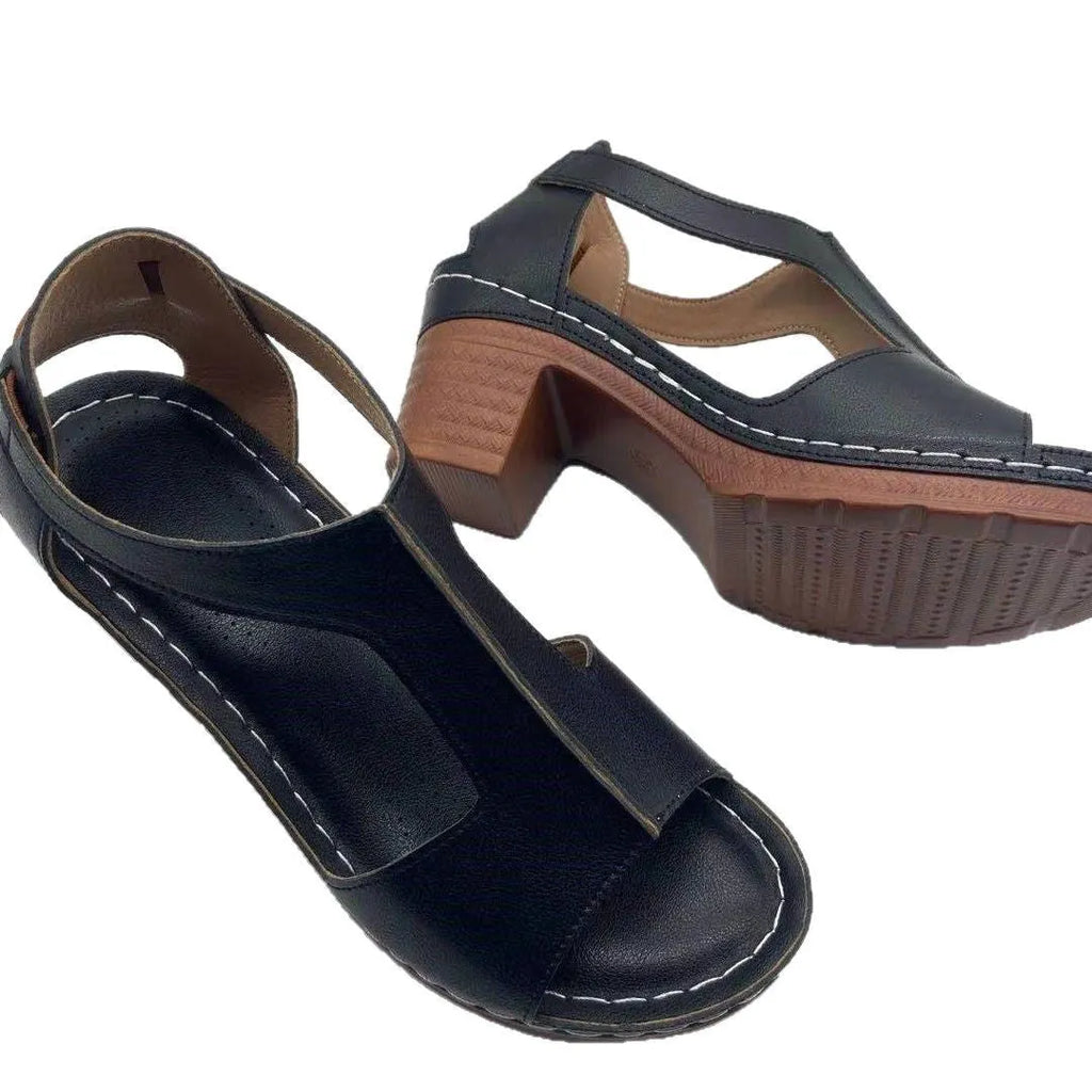Women's plus size beige peep toe wedge sandals with a buckle strap and low heel.
